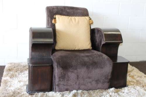 An incredible and rare Art Deco "club" armchair with drinks-rest in a rich chocolate brown fabric