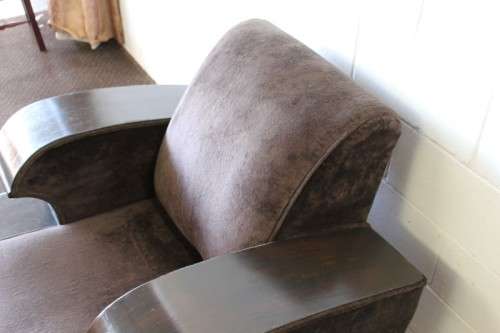 An incredible and rare Art Deco "club" armchair with drinks-rest in a rich chocolate brown fabric