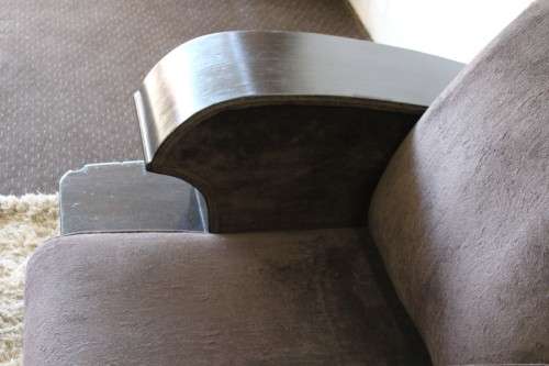 An incredible and rare Art Deco "club" armchair with drinks-rest in a rich chocolate brown fabric