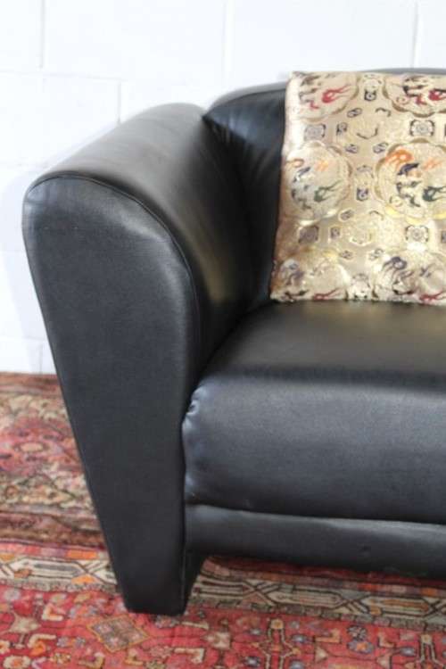 **RS17** A stylish, comfortable modern-styled black leather-feel armchair in awesome condition