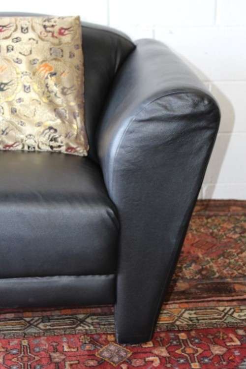 **RS17** A stylish, comfortable modern-styled black leather-feel armchair in awesome condition