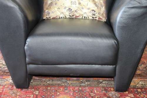 **RS17** A stylish, comfortable modern-styled black leather-feel armchair in awesome condition