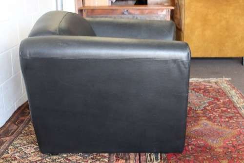 **RS17** A stylish, comfortable modern-styled black leather-feel armchair in awesome condition