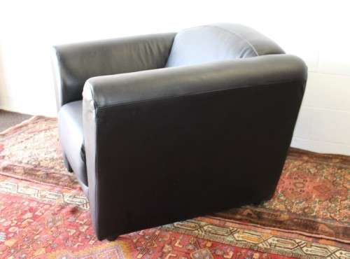 **RS17** A stylish, comfortable modern-styled black leather-feel armchair in awesome condition