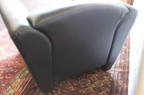 **RS17** A stylish, comfortable modern-styled black leather-feel armchair in awesome condition