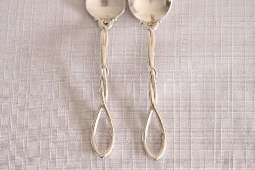 A beautiful antique sterling silver Art Nouveau (c1895 to 1910) USA made fruit spoon & fork set