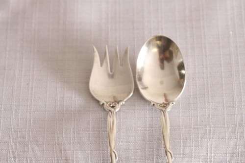 A beautiful antique sterling silver Art Nouveau (c1895 to 1910) USA made fruit spoon & fork set