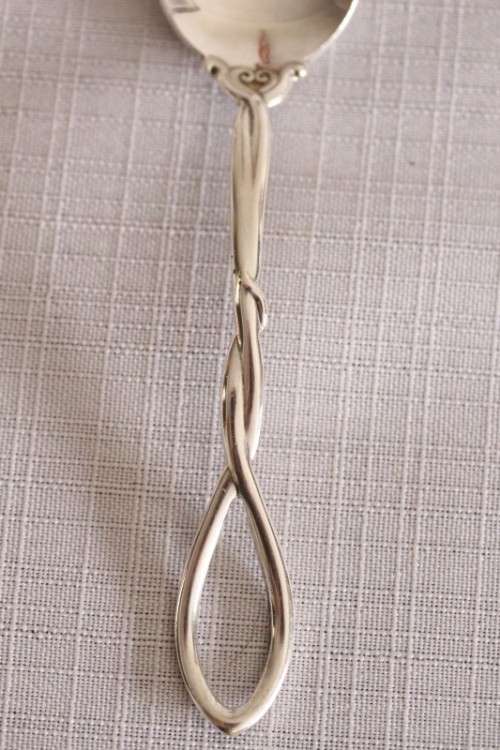 A beautiful antique sterling silver Art Nouveau (c1895 to 1910) USA made fruit spoon & fork set