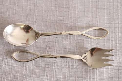 A beautiful antique sterling silver Art Nouveau (c1895 to 1910) USA made fruit spoon & fork set