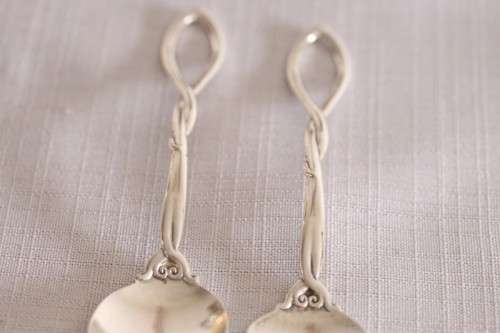 A beautiful antique sterling silver Art Nouveau (c1895 to 1910) USA made fruit spoon & fork set