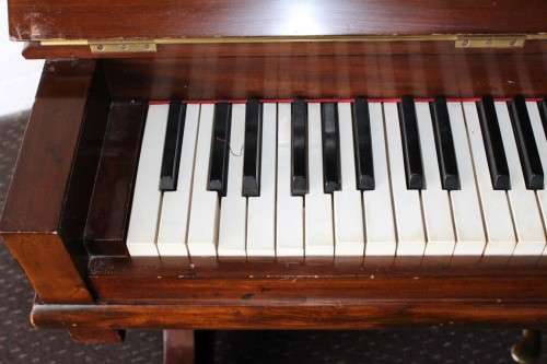 A spectacular antique Edwardian "John Brinsmead & Sons" upright piano - elegant addition to a lounge