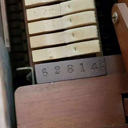 A spectacular antique Edwardian "John Brinsmead & Sons" upright piano - elegant addition to a lounge