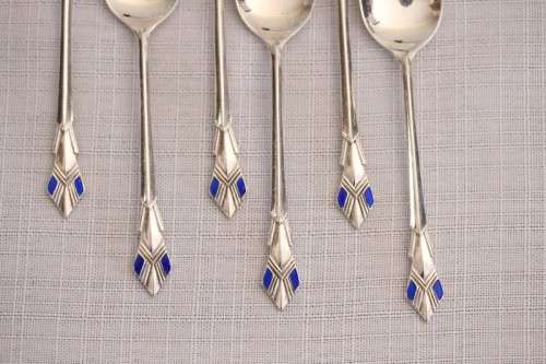 A superb set of 6x original Art Deco hallmarked sterling silver demitasse spoons w/ enamel detailing