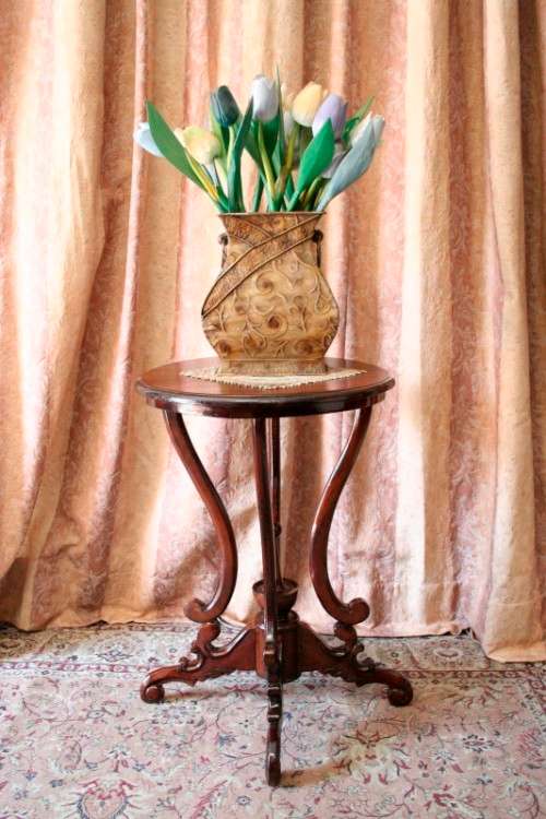 A fabulous stylish vintage Teak display/ occasional table with a ornate centre leg