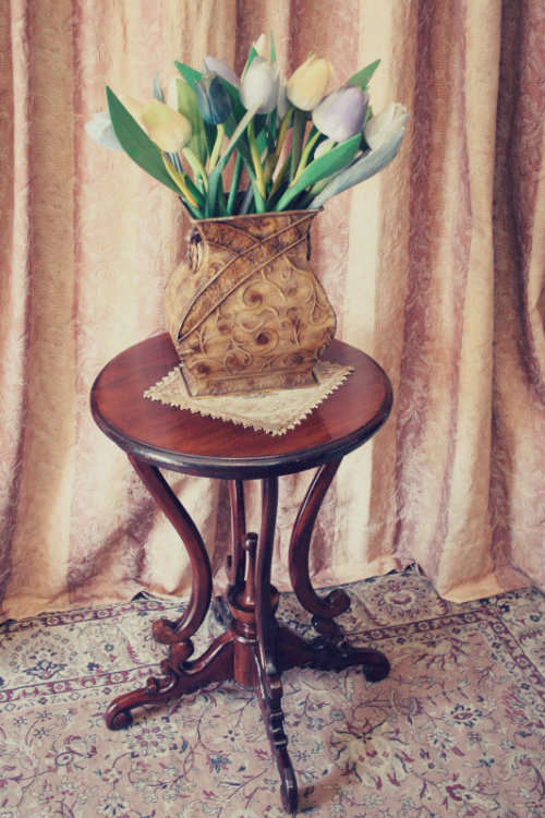 A fabulous stylish vintage Teak display/ occasional table with a ornate centre leg