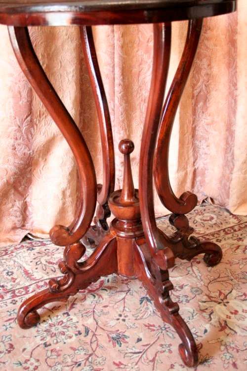 A fabulous stylish vintage Teak display/ occasional table with a ornate centre leg