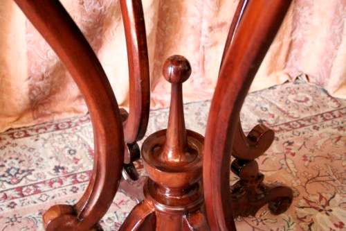 A fabulous stylish vintage Teak display/ occasional table with a ornate centre leg