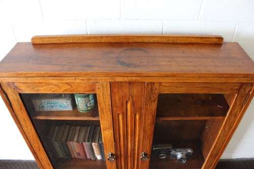 A wonderful Art Deco vintage oak display/ show cabinet with glass doors and carved detailing!