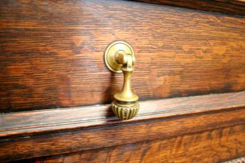 An exquisite vintage Oak side server cabinet with brass handles & loads of drawer & cupboard space