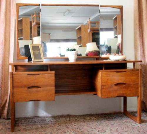 An exquisite Teak retro styled four drawer side-folding mirror dressing table and stool.