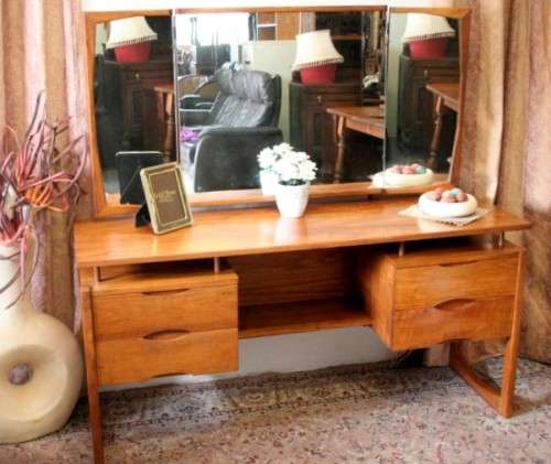 An exquisite Teak retro styled four drawer side-folding mirror dressing table and stool.