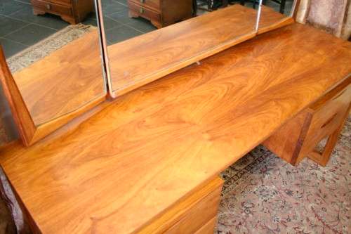 An exquisite Teak retro styled four drawer side-folding mirror dressing table and stool.