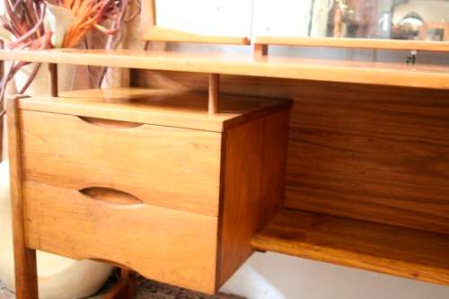 An exquisite Teak retro styled four drawer side-folding mirror dressing table and stool.