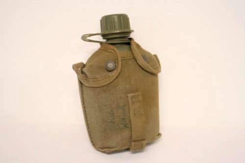 **RS17** A vintage olive green SADF military water bottle with webbing cover in good condition
