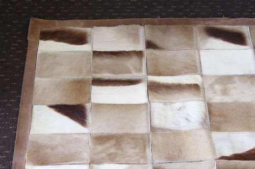 **RS17** A stunning rectangular (1,8m x 1,07m) Springbok hide rug/ mat with hand stitched detailing