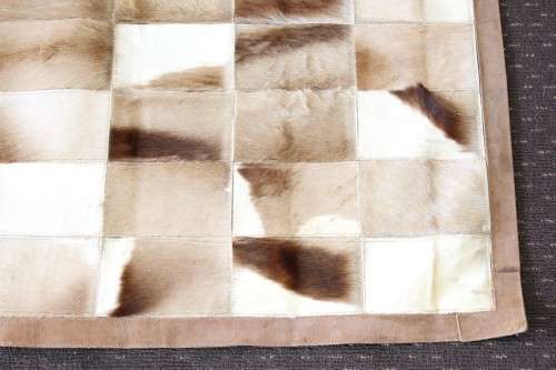 **RS17** A stunning rectangular (1,8m x 1,07m) Springbok hide rug/ mat with hand stitched detailing