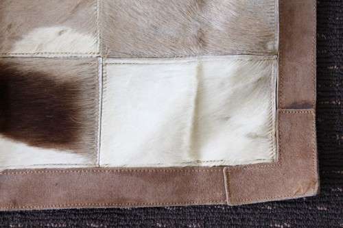 **RS17** A stunning rectangular (1,8m x 1,07m) Springbok hide rug/ mat with hand stitched detailing