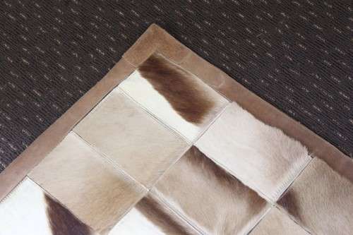 **RS17** A stunning rectangular (1,8m x 1,07m) Springbok hide rug/ mat with hand stitched detailing