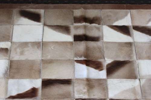 **RS17** A stunning rectangular (1,8m x 1,07m) Springbok hide rug/ mat with hand stitched detailing