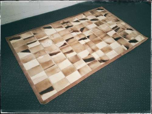 **RS17** A stunning rectangular (1,8m x 1,07m) Springbok hide rug/ mat with hand stitched detailing