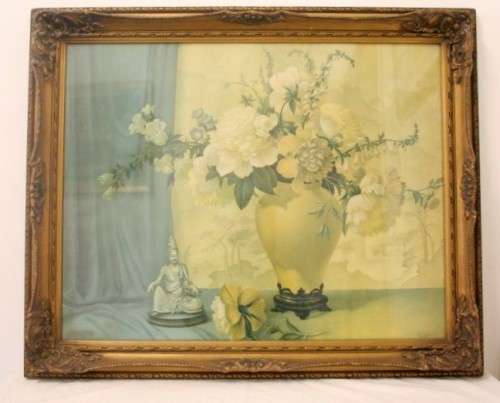 A fabulous antique moulded picture frame with a gorgeous flower print behind glass..