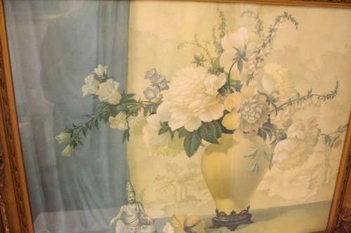 A fabulous antique moulded picture frame with a gorgeous flower print behind glass..