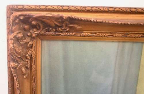 A fabulous antique moulded picture frame with a gorgeous flower print behind glass..