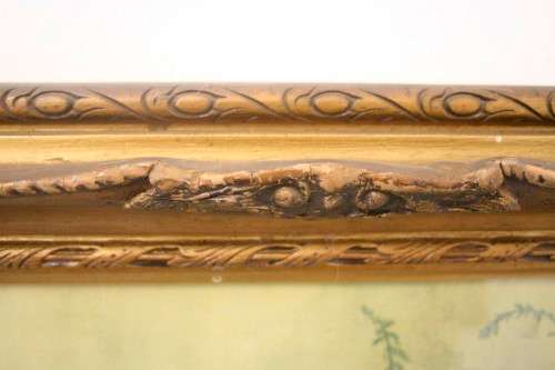 A fabulous antique moulded picture frame with a gorgeous flower print behind glass..