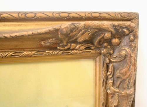 A fabulous antique moulded picture frame with a gorgeous flower print behind glass..