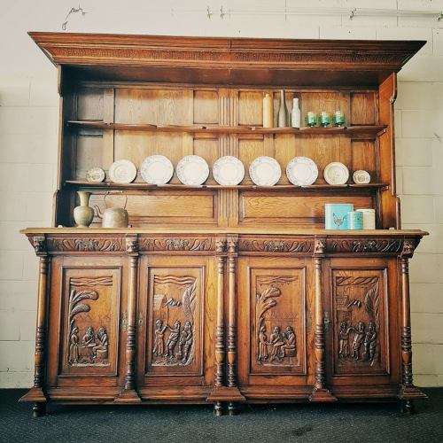 An impressive antique 19th-century Flemish honeyed Oak double-buffet w/ incredible carved detailing