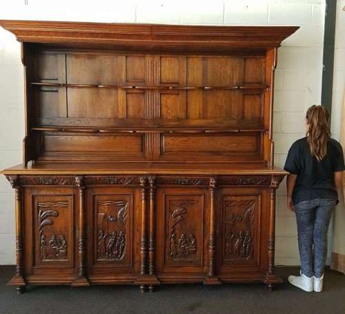An impressive antique 19th-century Flemish honeyed Oak double-buffet w/ incredible carved detailing