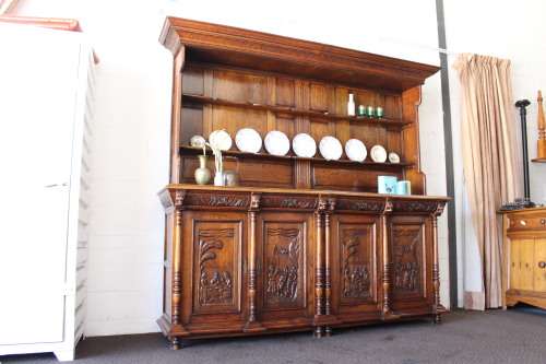 An impressive antique 19th-century Flemish honeyed Oak double-buffet w/ incredible carved detailing