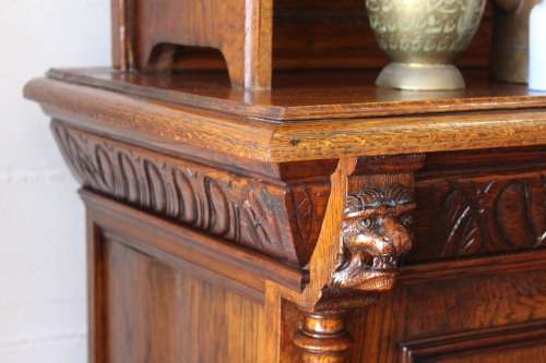 An impressive antique 19th-century Flemish honeyed Oak double-buffet w/ incredible carved detailing