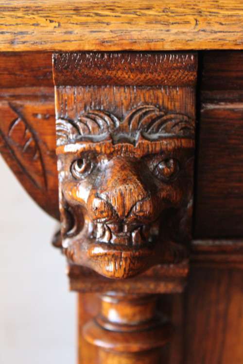 An impressive antique 19th-century Flemish honeyed Oak double-buffet w/ incredible carved detailing