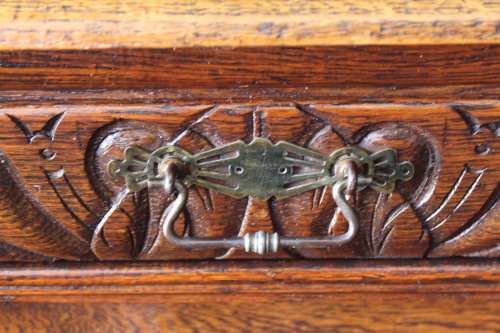 An impressive antique 19th-century Flemish honeyed Oak double-buffet w/ incredible carved detailing