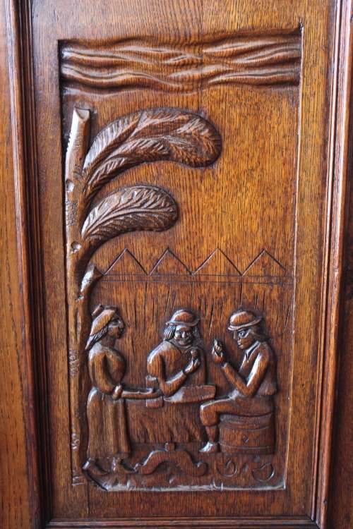 An impressive antique 19th-century Flemish honeyed Oak double-buffet w/ incredible carved detailing