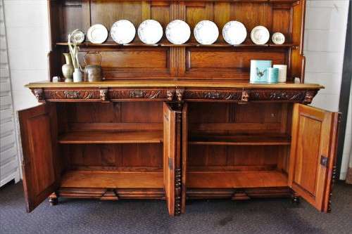 An impressive antique 19th-century Flemish honeyed Oak double-buffet w/ incredible carved detailing