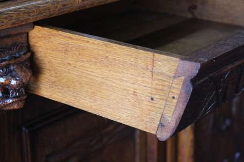 An impressive antique 19th-century Flemish honeyed Oak double-buffet w/ incredible carved detailing