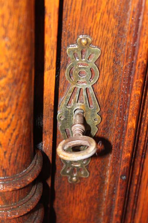 An impressive antique 19th-century Flemish honeyed Oak double-buffet w/ incredible carved detailing
