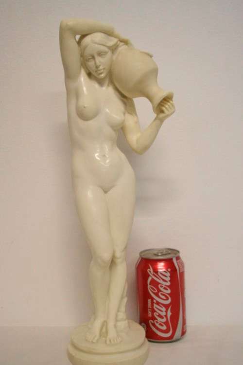 A fantastic large oxylite figurine of a woman carrying a water pitcher. Beautiful on display!!